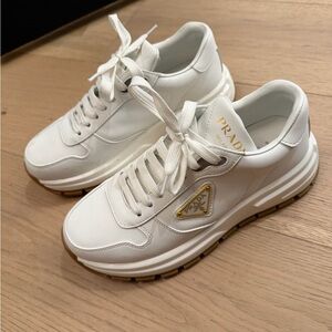 Prada White and Gold Accent Sneakers